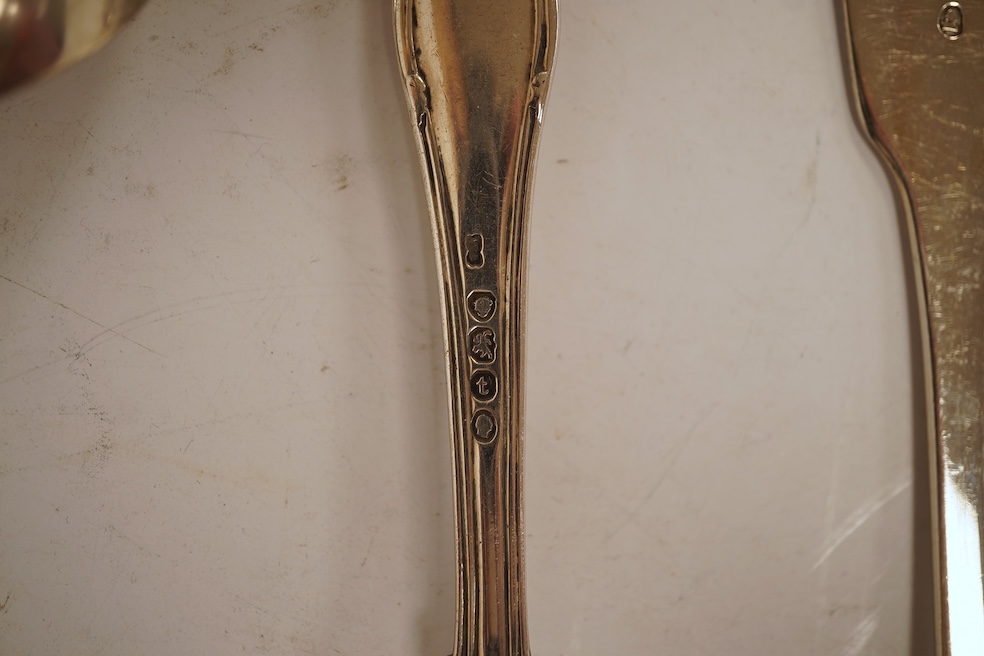 A George III silver fiddle pattern stilton scoop, John Lias, London, 1816, 20cm, together with two Georgian silver sauce ladles, a similar sifter ladle and a William IV shell pattern fish knife, 8.9oz.